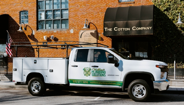 Matthews-Plumbing-truck-parked-The-Cotton-Company-in-Wake-Forest-NC