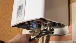 Close-up of a tankless water heater being installed 